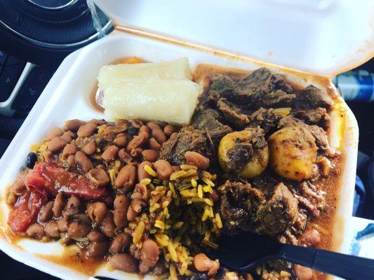 Beef with yellow rice, red beans and yuca