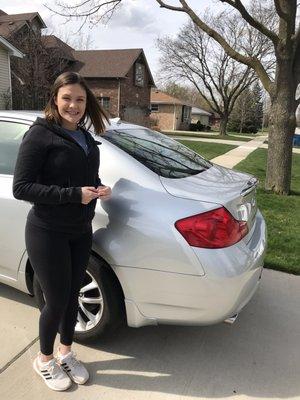 Granddaughter is very excited and happy showing the rear of the car. The interior is immaculate .