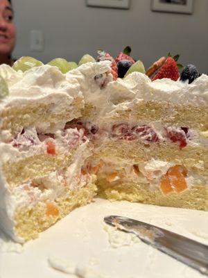 6" whipped cream sponge cake with lots of strawberry and cantaloupe inside. Not too sweet!