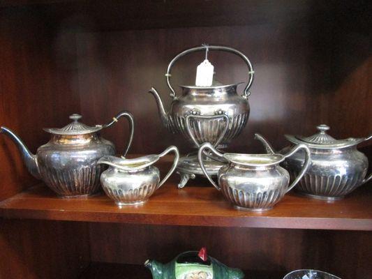 Five piece silver plated tea set with teapot on stand