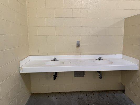 The sinks in the women's restroom. No baby changing table but I guess that's why the counter is longer?