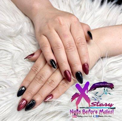 Gel x short almond with black and red chrome