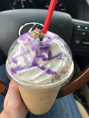 Iced white chocolate mocha with whip and chocolate covered espresso bean