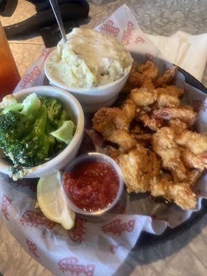 Crunchy Fried Shrimp, Garlic Potatoes and Gravy, Steamed Broccoli in garlic butter sauce.