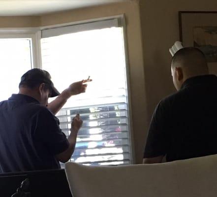 Steven and David installing the blinds at the bay window.