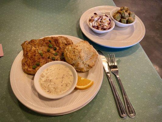 The Southern House special at Crazy Pig. Pork, biscuit, gravy. Sides are Cajun slaw and fried okra.