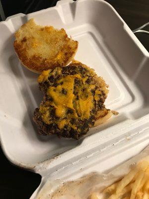 Dried up over cooked Pub burger with canned cheese whiz.  Not worth eating.