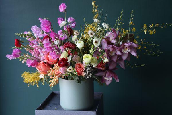 sweet heart, orchid , ranunculus mix flower arrnagement