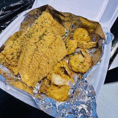 Catfish and shrimp platter. Instead of fries, I got rice which is underneath the foil.