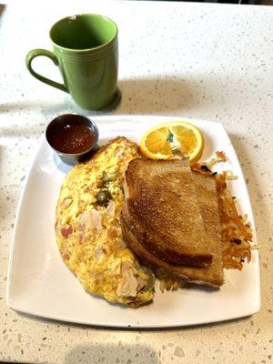 Jalapeño cheese with turkey omelet with hash browns and toast.