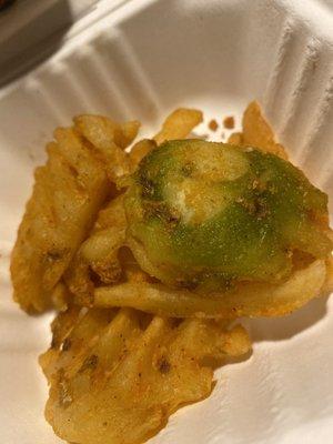 it's waffle fries that are green and discolored. green potatoes are nothing to mess with. especially not that severe of discoloration.