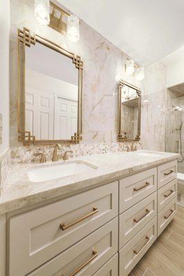 Luxury Bathroom with Onyx tile and champagne gold hardware.