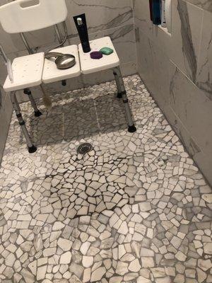 Water pooling in master bath shower