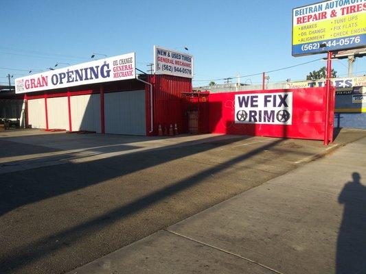 The entrance of the place is on the same lot as the gas station. They're right next to eachother.