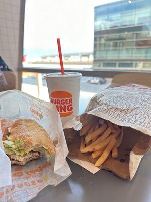 Original Chicken Sandwich combo meal (small) with a view of the tarmac and mountains (not pictured)