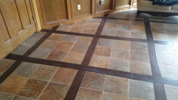 Grid pattern with wood and tile inlay.  Gorgeous floor!!