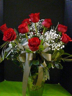 Dozen Roses, Babies Breath, Fancy Assorted Greens, Ribbon  $97