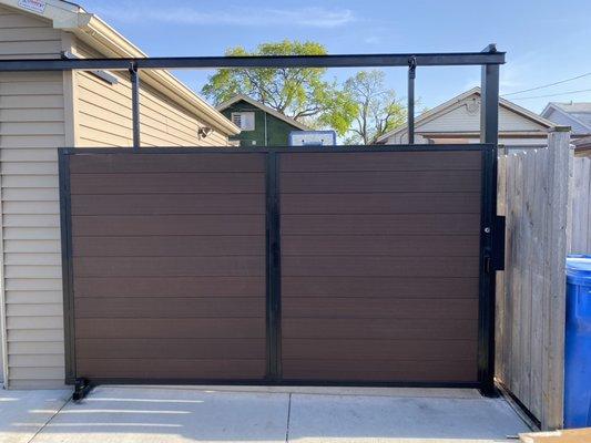 Custom slide gate for carport , also made with European green wood .