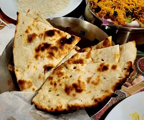 Butter and Garlic Naan. $4.50 each.