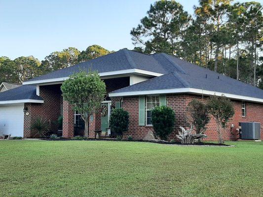 Certinteed "Black Moire".  Perfect combination with the color of brick used in my home.