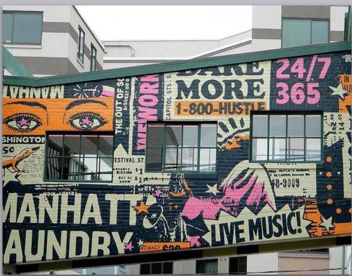 Office entrance is under the mural walkway.