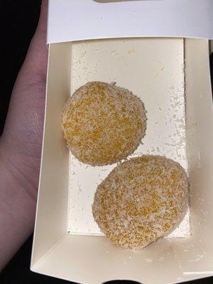 mango mochi with coconut and mango slices inside