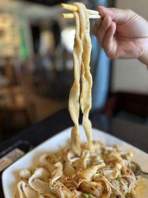 Scalded chili noodles - wide hand stretched noodles