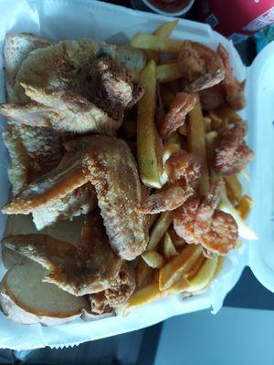 Combo #2 Shrimp, catfish and wings with fries and bread.