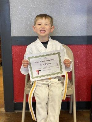 The 2 month trial was just enough time to help him understand the concept of working towards goals (he earned a gold belt in this picture!)