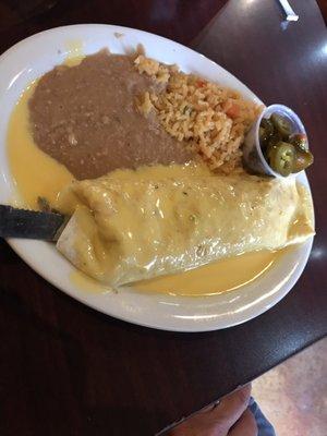 Beef fajita burrito covered in delicious queso