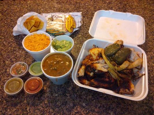 Chicken, rice, beans, chips and guacamole, tortillas (which you can request warm or in a package), and four different salsas