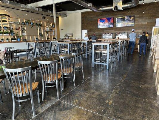 Inside from street side near the large garage doors facing the bar.