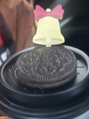 Oreo cuddles hot cocoa, topped with an Oreo.