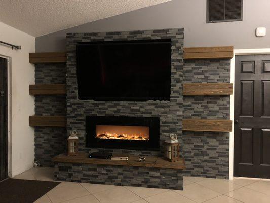 Ledger stone tv and fire place wall that I built.