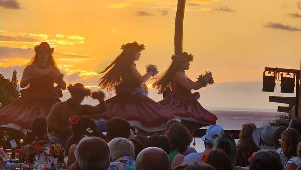 Hula dancers; sunset view.