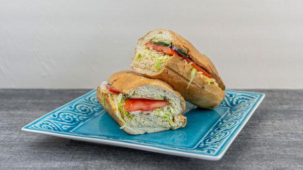 Get ready to be twisted by flavor with our 'Tuna Twist' sub sandwich - a delightful blend of savory tuna & fresh veggies.