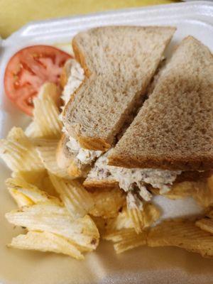 Chicken salad sandwich with potato chips