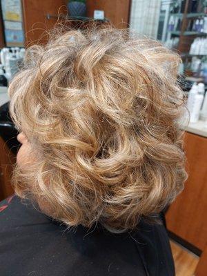 Heavy highlights with a fun messy curl  80 ?? Maybe !!!