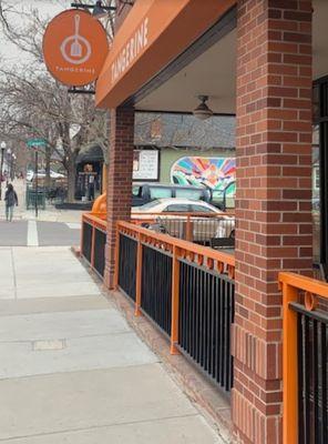 The sign and outdoor seating.