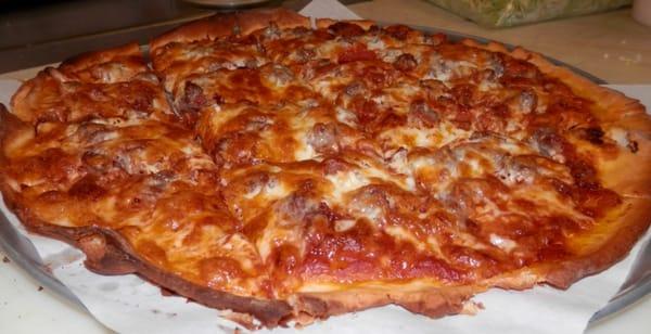 This is our meatlovers pizza. Beneath the golden cheese lies layers of meat to your liking!