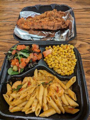 Deep fried lobster tail, Rasta pasta, Cajun corn, and the side salad.