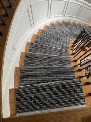 Curved steps featuring our custom carpet runner!