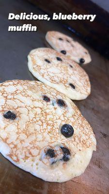 Delicious, blueberry pancakes. It goes as a platter with eggs and bacon or just pancakes on a platter.