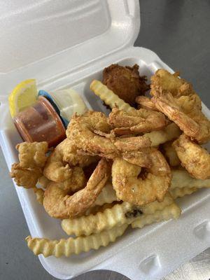 Our 1/2 dinner with fresh, local, wild caught, fried shrimp, fries, homemade hushpuppies!