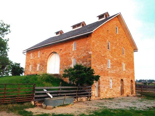 Historic Taylor Barn was built in 1879 from native limestone.  View from the northwest showing the forth floor, open to the west.