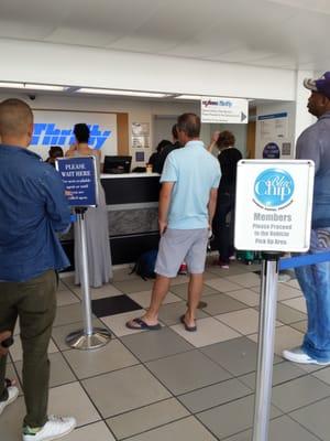 Longest slowest line at the car rental counters.