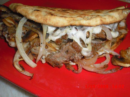 Philly Gyros with Swiss grill onion , tomatoes, lettuce and tzatziki.