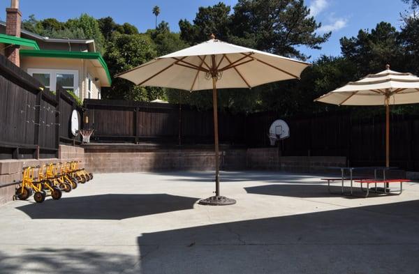 Our second play yard is shaded, large and flat complete with basketball hoops and tricycles to ride.