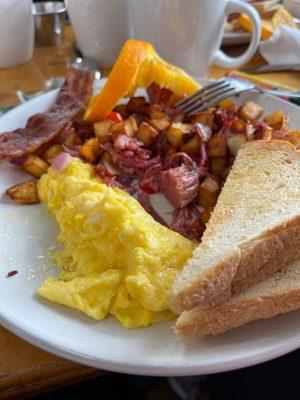 Fresh homemade corned beef hash! Soft scrambled eggs with cheese. Homemade toast! Yum!