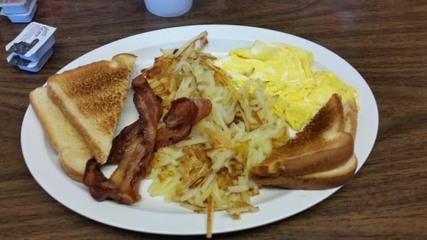 Scrambled eggs, bacon, toast. Great food low prices.  My little hole in the wall break fast place.